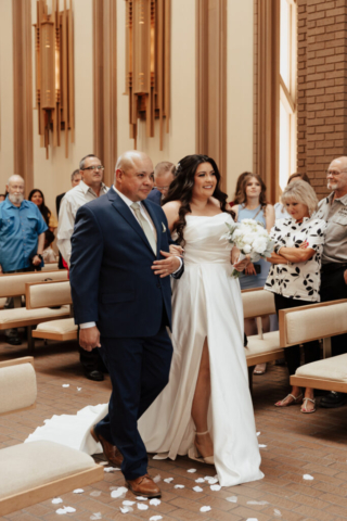 chapel-wedding-aisle-ceremony A young bride and groom at Marty Leonard Chapel on their intimate wedding day in Fort Worth, Texas.