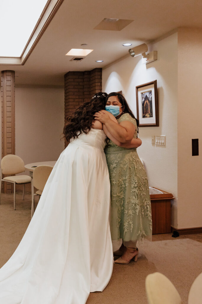 A young bride and groom at Marty Leonard Chapel on their intimate wedding day in Fort Worth, Texas.