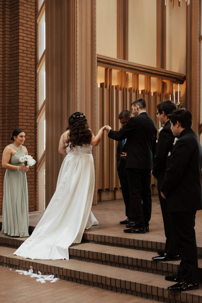 A young bride and groom at Marty Leonard Chapel on their intimate wedding day in Fort Worth, Texas.