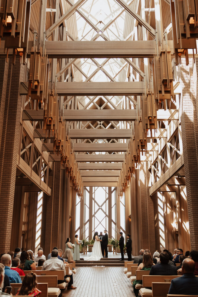 A young bride and groom at Marty Leonard Chapel on their intimate wedding day in Fort Worth, Texas.