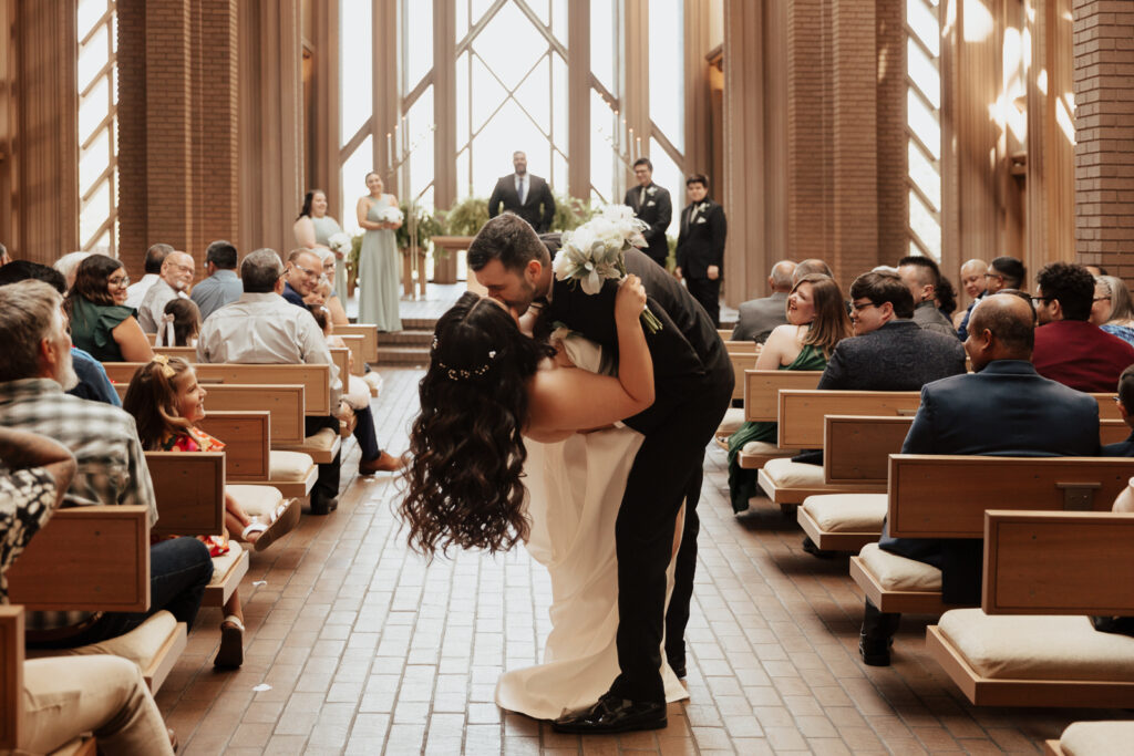 A young bride and groom at Marty Leonard Chapel on their intimate wedding day in Fort Worth, Texas.