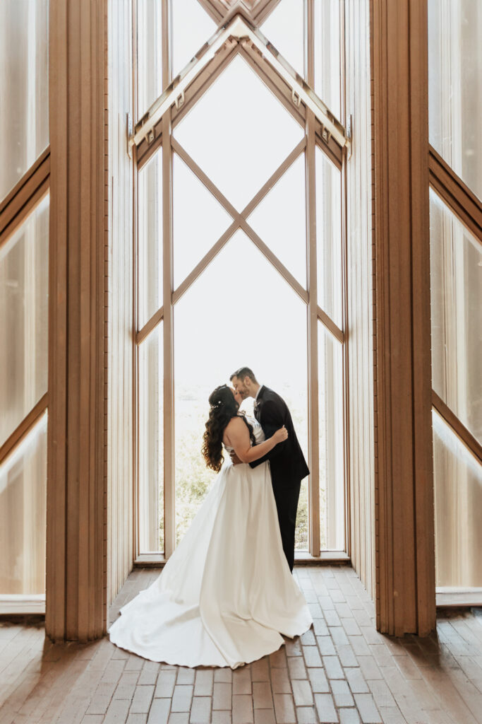 A young bride and groom at Marty Leonard Chapel on their intimate wedding day in Fort Worth, Texas.