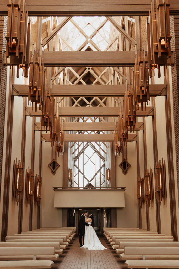 A young bride and groom at Marty Leonard Chapel on their intimate wedding day in Fort Worth, Texas.