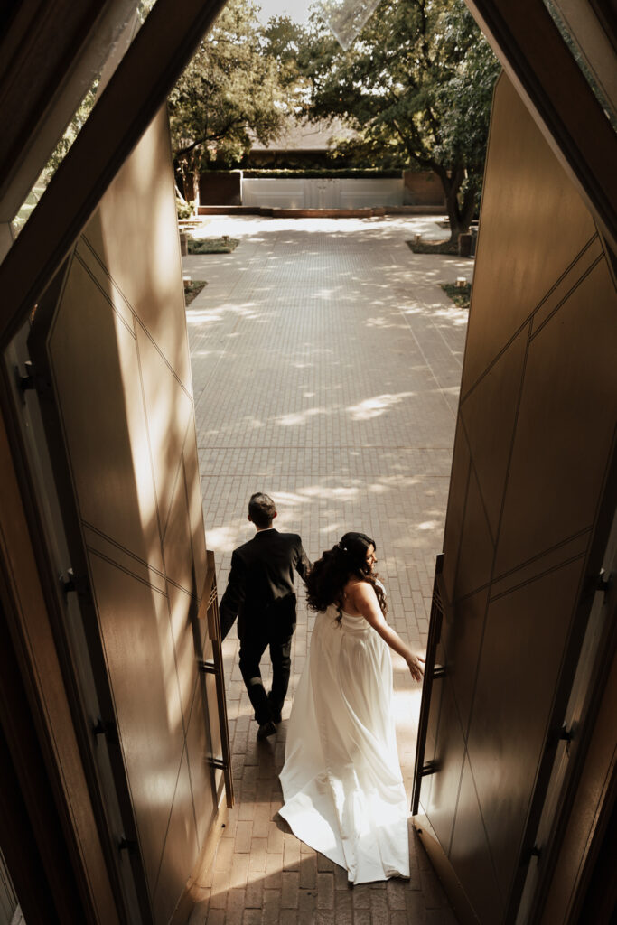 A young bride and groom at Marty Leonard Chapel on their intimate wedding day in Fort Worth, Texas.