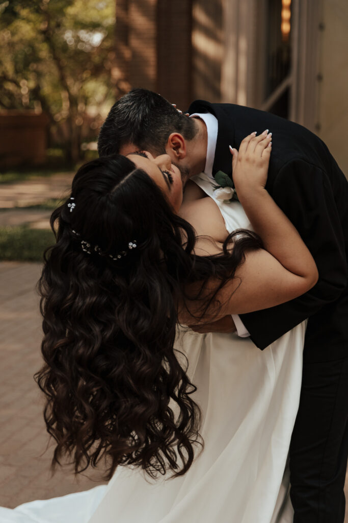 A young bride and groom at Marty Leonard Chapel on their intimate wedding day in Fort Worth, Texas.