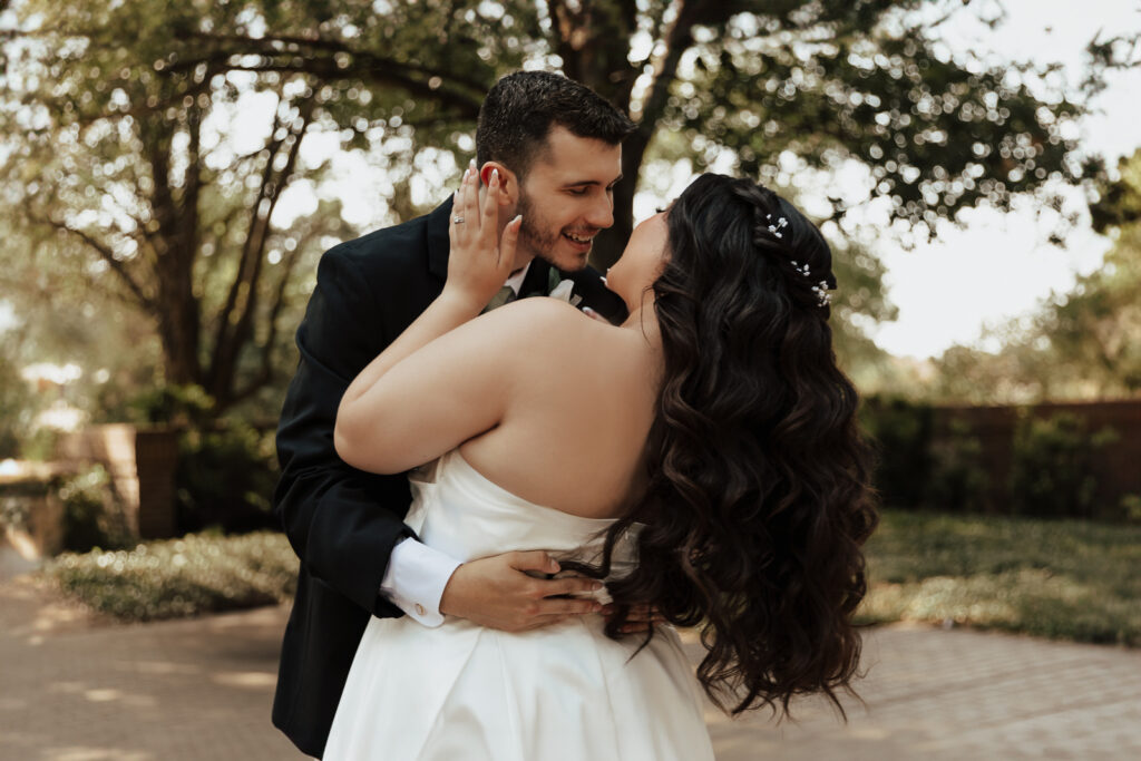 A young bride and groom at Marty Leonard Chapel on their intimate wedding day in Fort Worth, Texas.