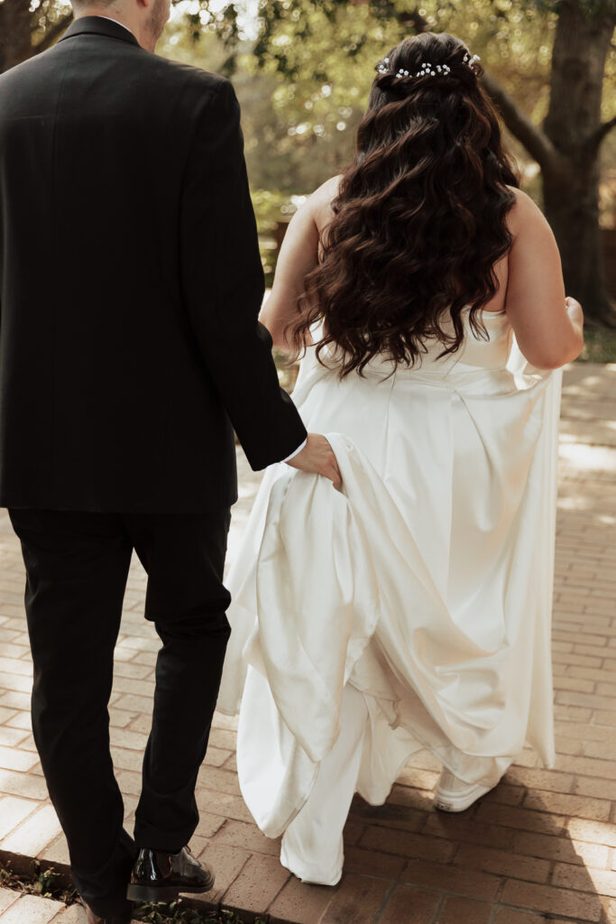 A young bride and groom at Marty Leonard Chapel on their intimate wedding day in Fort Worth, Texas.