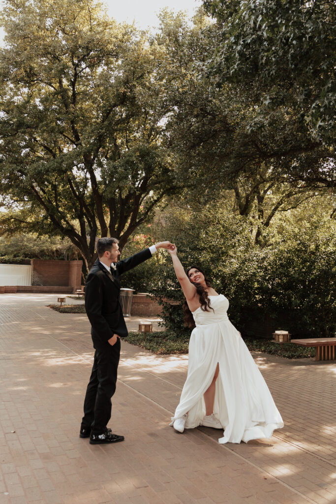A young bride and groom at Marty Leonard Chapel on their intimate wedding day in Fort Worth, Texas.
