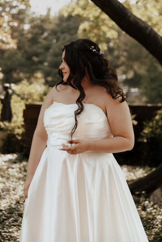 A young bride and groom at Marty Leonard Chapel on their intimate wedding day in Fort Worth, Texas.