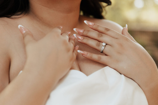 details-french-tip-nails-dallas A young bride and groom at Marty Leonard Chapel on their intimate wedding day in Fort Worth, Texas.