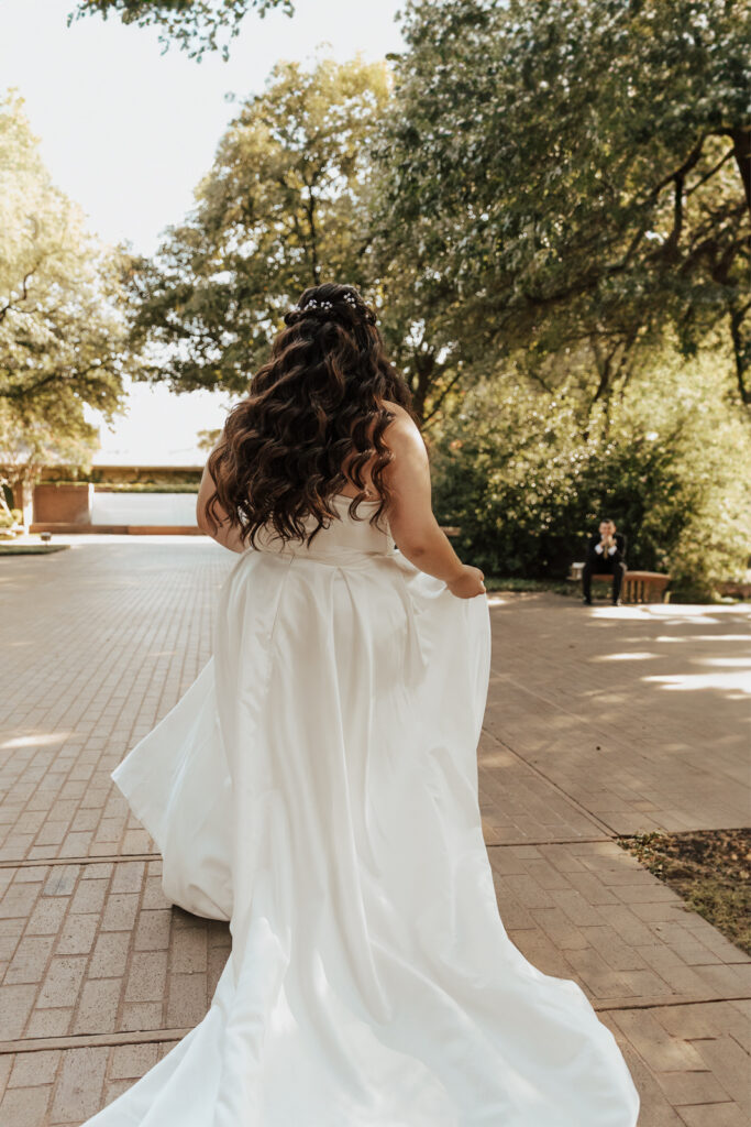 A young bride and groom at Marty Leonard Chapel on their intimate wedding day in Fort Worth, Texas.