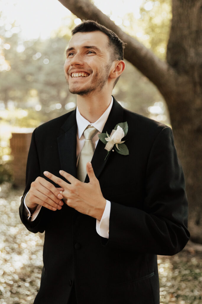 A young bride and groom at Marty Leonard Chapel on their intimate wedding day in Fort Worth, Texas.