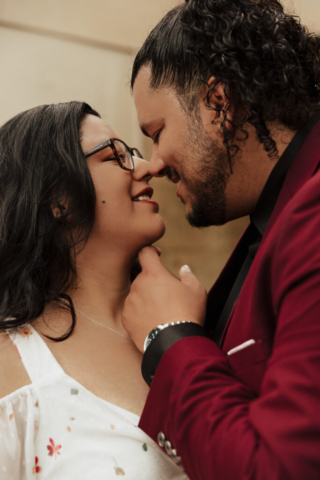 A bride and groom in their wedding attire on their wedding day take their romantic and natural documentary styled photos at the Dallas Arboretum.