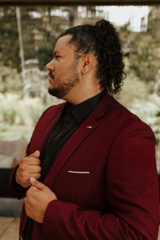 A bride and groom in their wedding attire on their wedding day take their romantic and natural documentary styled photos at the Dallas Arboretum.