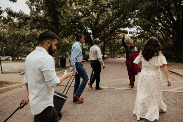 A bride and groom in their wedding attire on their wedding day take their romantic and natural documentary styled photos at the Dallas Arboretum.