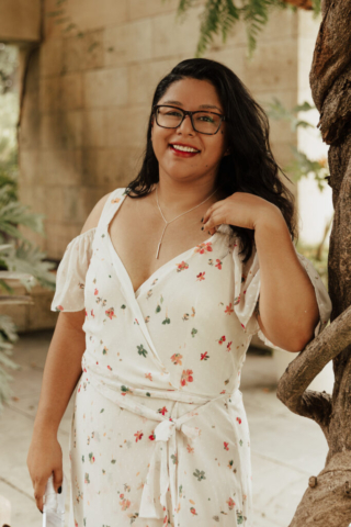 A bride and groom in their wedding attire on their wedding day take their romantic and natural documentary styled photos at the Dallas Arboretum.