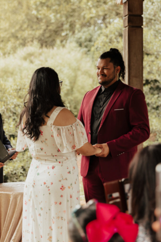 A bride and groom in their wedding attire on their wedding day take their romantic and natural documentary styled photos at the Dallas Arboretum.