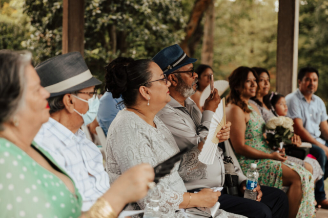 A bride and groom in their wedding attire on their wedding day take their romantic and natural documentary styled photos at the Dallas Arboretum.