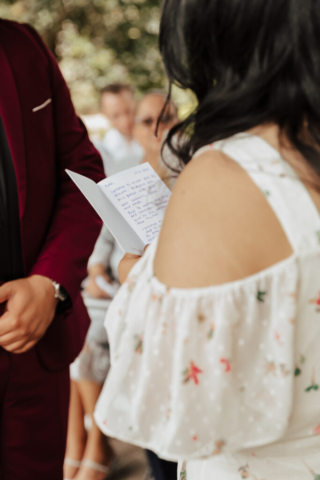 A bride and groom in their wedding attire on their wedding day take their romantic and natural documentary styled photos at the Dallas Arboretum.
