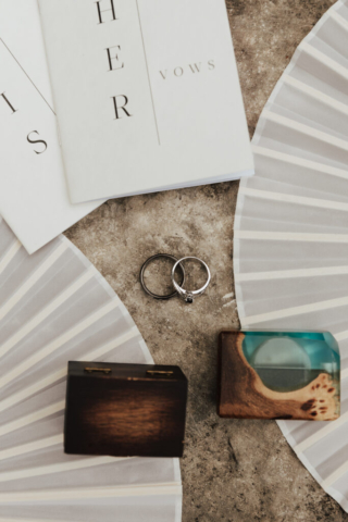 A bride and groom in their wedding attire on their wedding day take their romantic and natural documentary styled photos at the Dallas Arboretum.