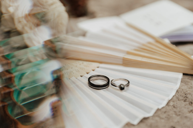 A bride and groom in their wedding attire on their wedding day take their romantic and natural documentary styled photos at the Dallas Arboretum.