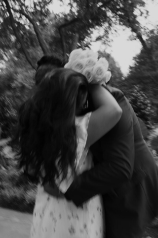 A bride and groom in their wedding attire on their wedding day take their romantic and natural documentary styled photos at the Dallas Arboretum.