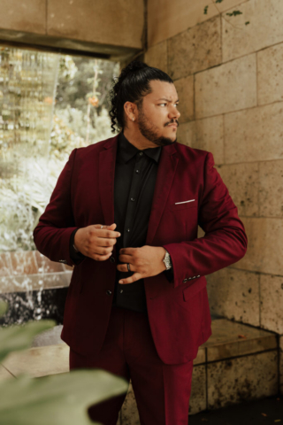 A bride and groom in their wedding attire on their wedding day take their romantic and natural documentary styled photos at the Dallas Arboretum.
