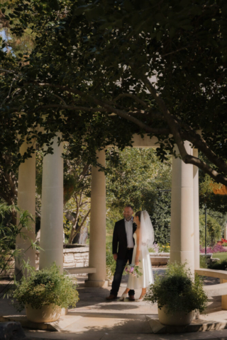 A young bride and groom at the Fort Worth Botanical Gardens on their intimate elopement wedding day in Fort Worth, Texas.