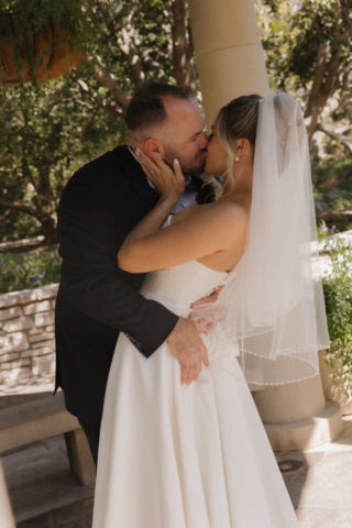 A young bride and groom at the Fort Worth Botanical Gardens on their intimate elopement wedding day in Fort Worth, Texas.