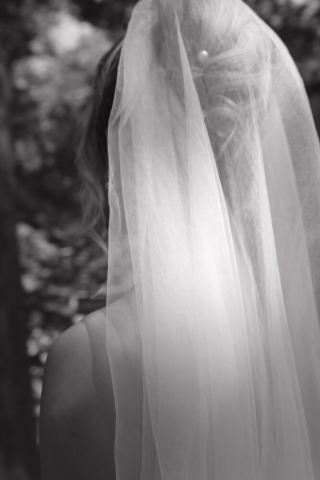 A young bride and groom at the Fort Worth Botanical Gardens on their intimate elopement wedding day in Fort Worth, Texas.