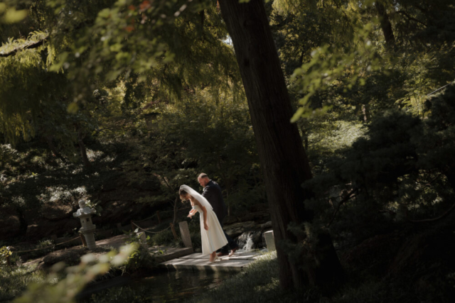 A young bride and groom at the Fort Worth Botanical Gardens on their intimate elopement wedding day in Fort Worth, Texas.