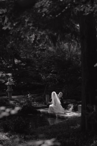 A young bride and groom at the Fort Worth Botanical Gardens on their intimate elopement wedding day in Fort Worth, Texas.