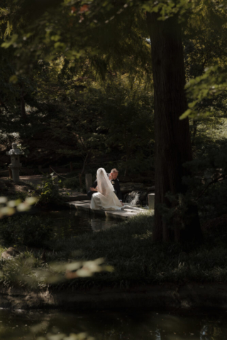 A young bride and groom at the Fort Worth Botanical Gardens on their intimate elopement wedding day in Fort Worth, Texas.