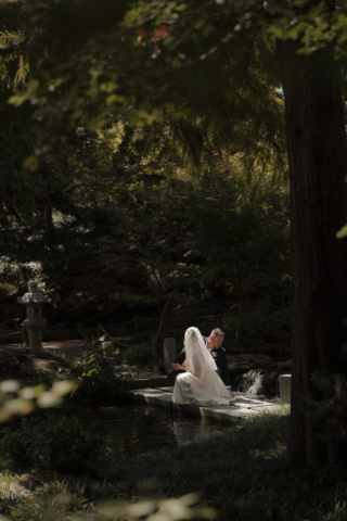 A young bride and groom at the Fort Worth Botanical Gardens on their intimate elopement wedding day in Fort Worth, Texas.