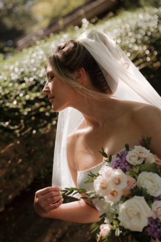 A young bride and groom at the Fort Worth Botanical Gardens on their intimate elopement wedding day in Fort Worth, Texas.