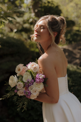 A young bride and groom at the Fort Worth Botanical Gardens on their intimate elopement wedding day in Fort Worth, Texas.