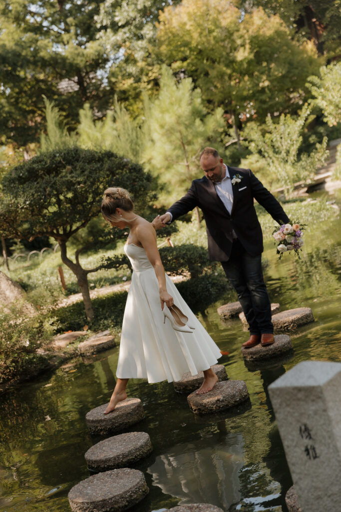 A young bride and groom at the Fort Worth Botanical Gardens on their intimate elopement wedding day in Fort Worth, Texas.