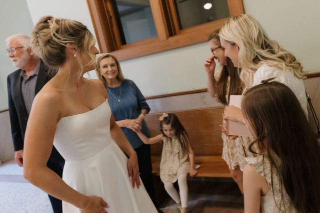 A young bride and groom at the Tarrant County Courthouse on their intimate elopement wedding day in Fort Worth, Texas.