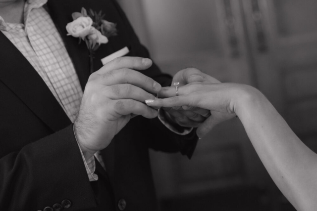 A young bride and groom at the Tarrant County Courthouse on their intimate elopement wedding day in Fort Worth, Texas.