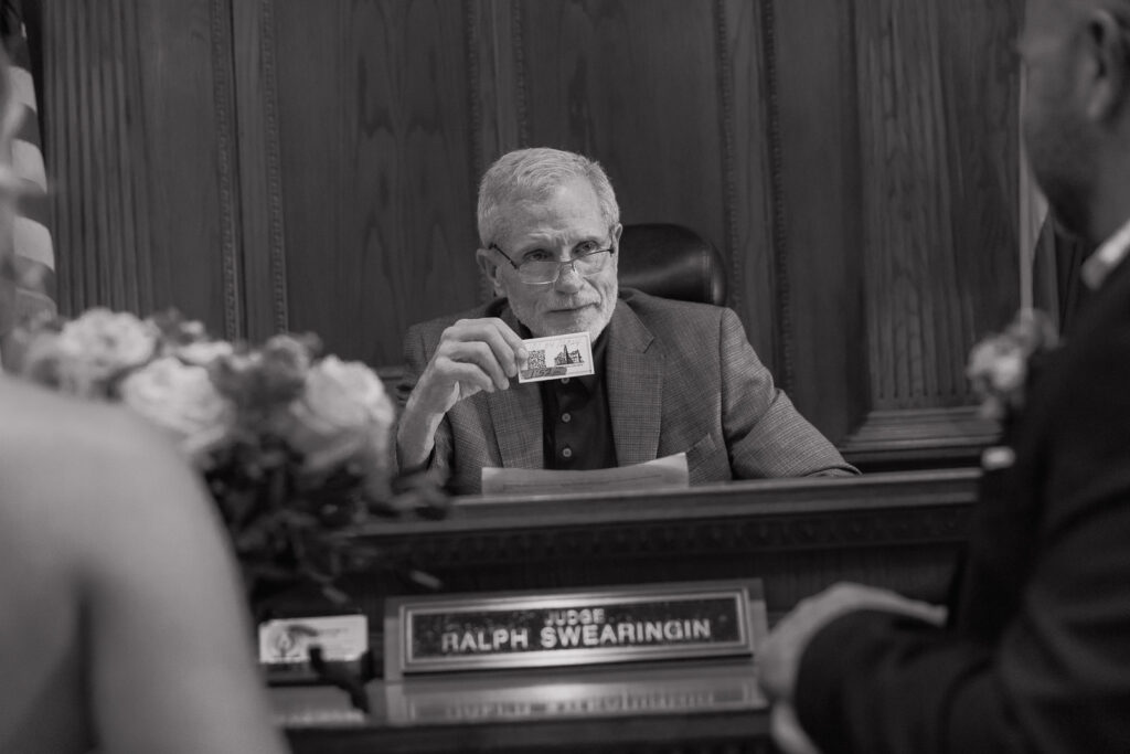 A young bride and groom at the Tarrant County Courthouse on their intimate elopement wedding day in Fort Worth, Texas.