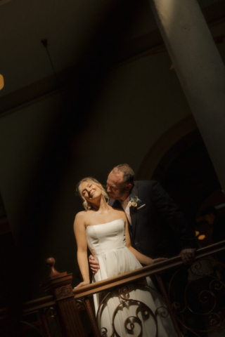 A young bride and groom at the Tarrant County Courthouse on their intimate elopement wedding day in Fort Worth, Texas.