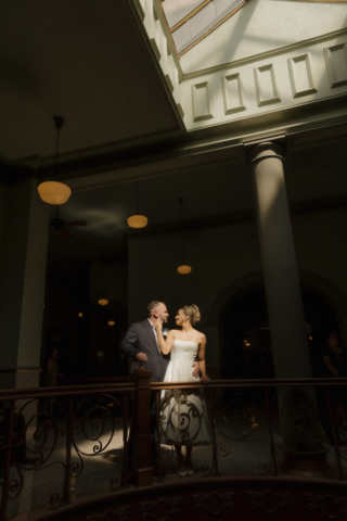 A young bride and groom at the Tarrant County Courthouse on their intimate elopement wedding day in Fort Worth, Texas.