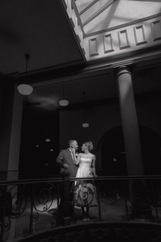 A young bride and groom at the Tarrant County Courthouse on their intimate elopement wedding day in Fort Worth, Texas.