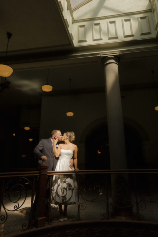 A young bride and groom at the Tarrant County Courthouse on their intimate elopement wedding day in Fort Worth, Texas.