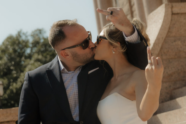 A young bride and groom at the Tarrant County Courthouse on their intimate elopement wedding day in Fort Worth, Texas.