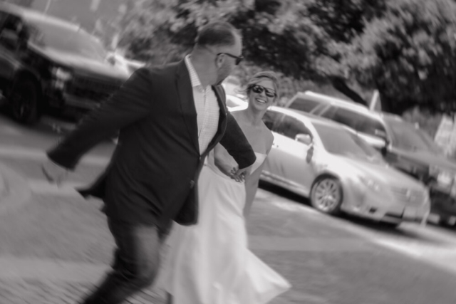 A young bride and groom at the Tarrant County Courthouse on their intimate elopement wedding day in Fort Worth, Texas.