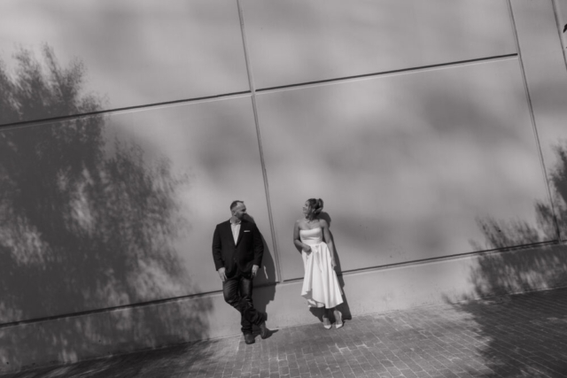 A young bride and groom at the Tarrant County Courthouse on their intimate elopement wedding day in Fort Worth, Texas.