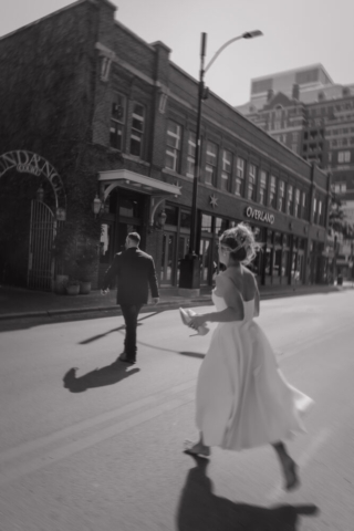 A young bride and groom at the Tarrant County Courthouse on their intimate elopement wedding day in Fort Worth, Texas.