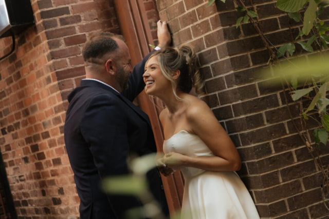 A young bride and groom at the Tarrant County Courthouse on their intimate elopement wedding day in Fort Worth, Texas.