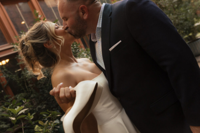 A young bride and groom at the Tarrant County Courthouse on their intimate elopement wedding day in Fort Worth, Texas.